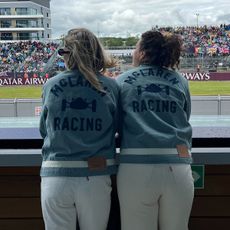 Eliza Huber and friend wearing denim Levi's x McLaren jackets and white jeans at the British Grand Prix.