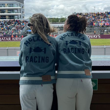 Eliza Huber and friend wearing denim Levi's x McLaren jackets and white jeans at the British Grand Prix.