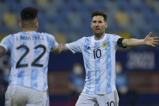 Lionel Messi celebrates with Lautaro Martinez after the striker's goal for Argentina against Ecuador at the 2021 Copa America.