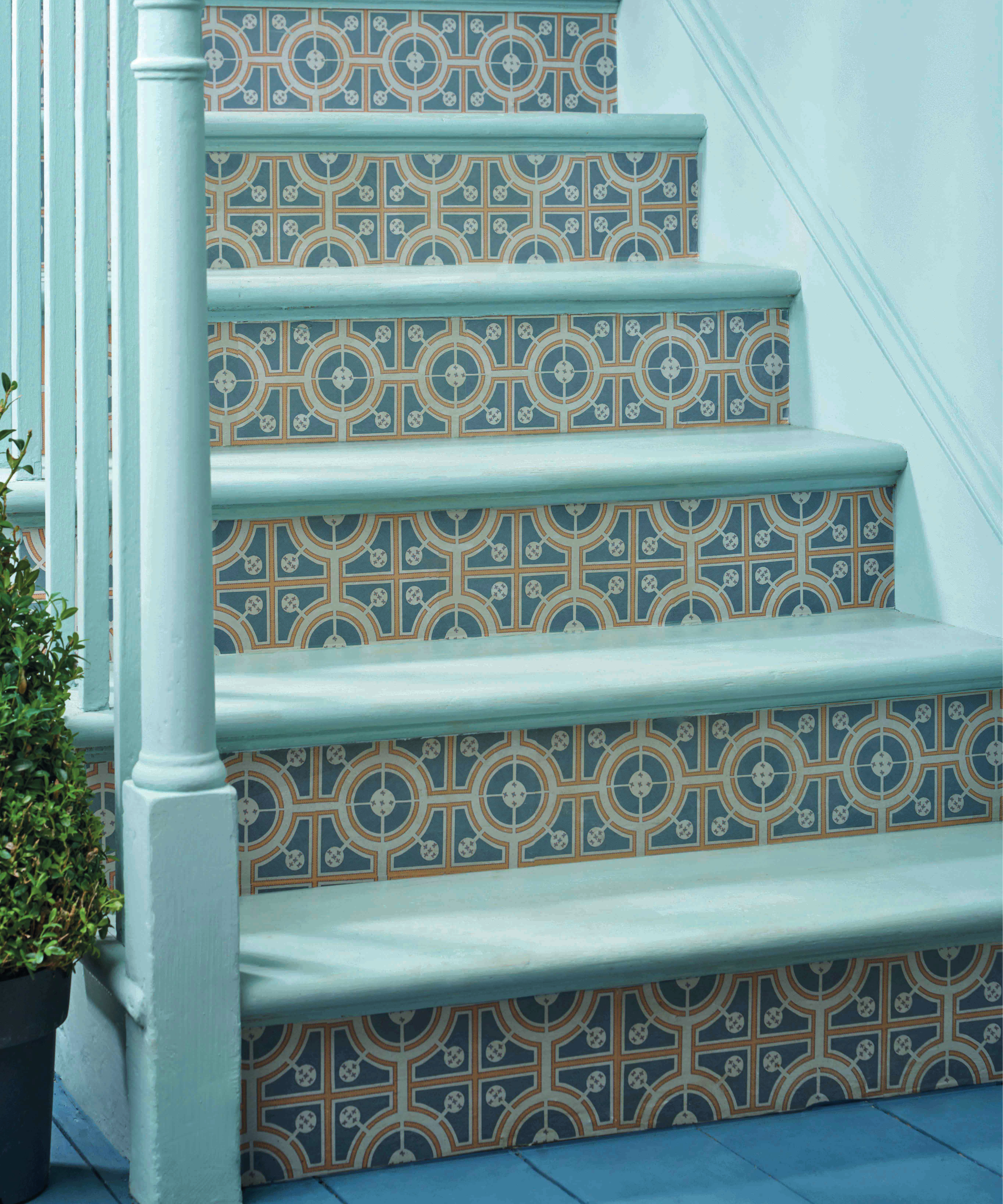 turquoise painted staircase with tiled treads
