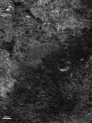 Sand dune patterns on the surface of Titan, seen in a radar image taken by the Cassini spacecraft. Two groups of researchers are investigating the forces responsible for forming the dunes.