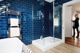 Loft conversion bathroom with blue tiles