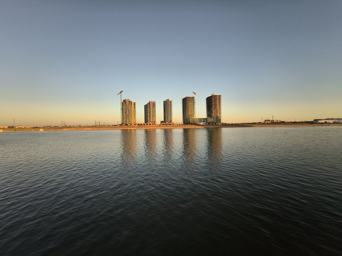 A photo of a lake and buildings captured with the Motorola Razr 2025 at 0.5x zoom.