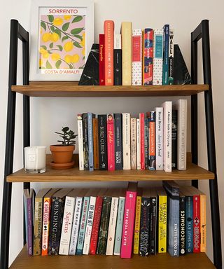 Styled bookshelf with frame and print from eBay, candle and marble book ends