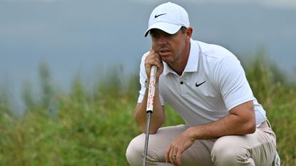 Rory McIlroy reads a putt