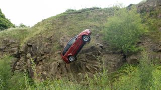 The car falls down the cliff