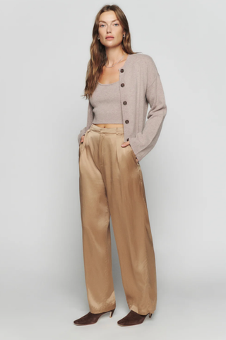 Model wears grey cardigan and crop top set