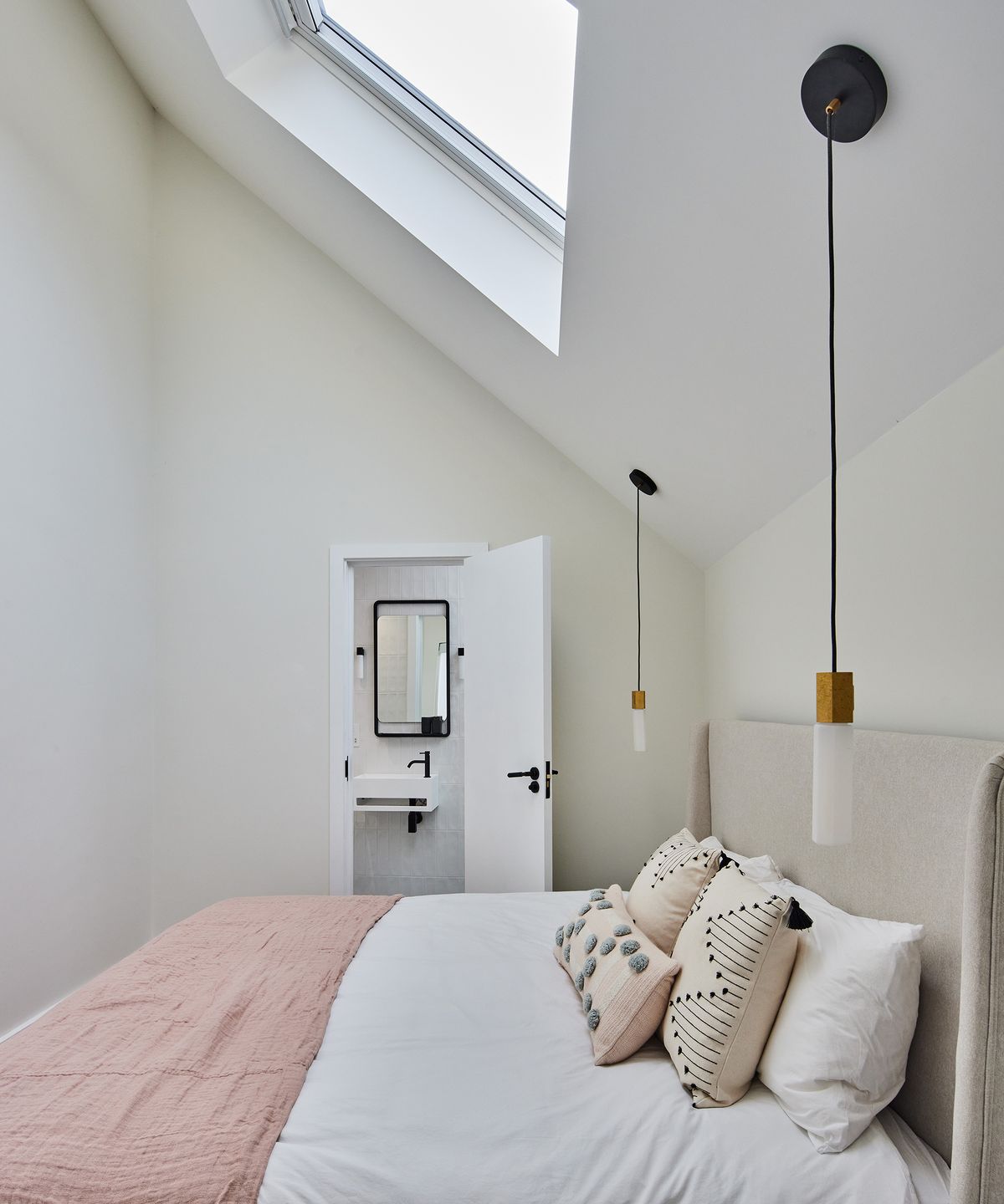 A small double bedroom which can be used. asa guest bedroom. There is a small ensuite bathroom which can be viewed through an open door.