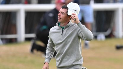 Rory McIlroy acknowledges the crowd as he walks up the final hole on the Old Course during the 2022 Open