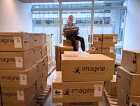 Yannick Olivier of France T&eacute;l&eacute;visions sits atop a newly delivered batch of Imagine SNP&ndash;XS units, highlighting the broadcaster&rsquo;s large&ndash;scale deployment.