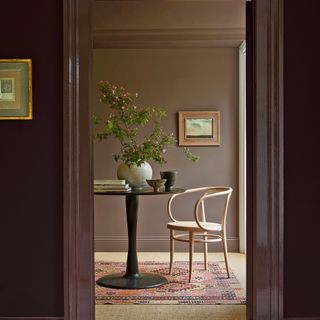 Purple hallway with doorway into dining room