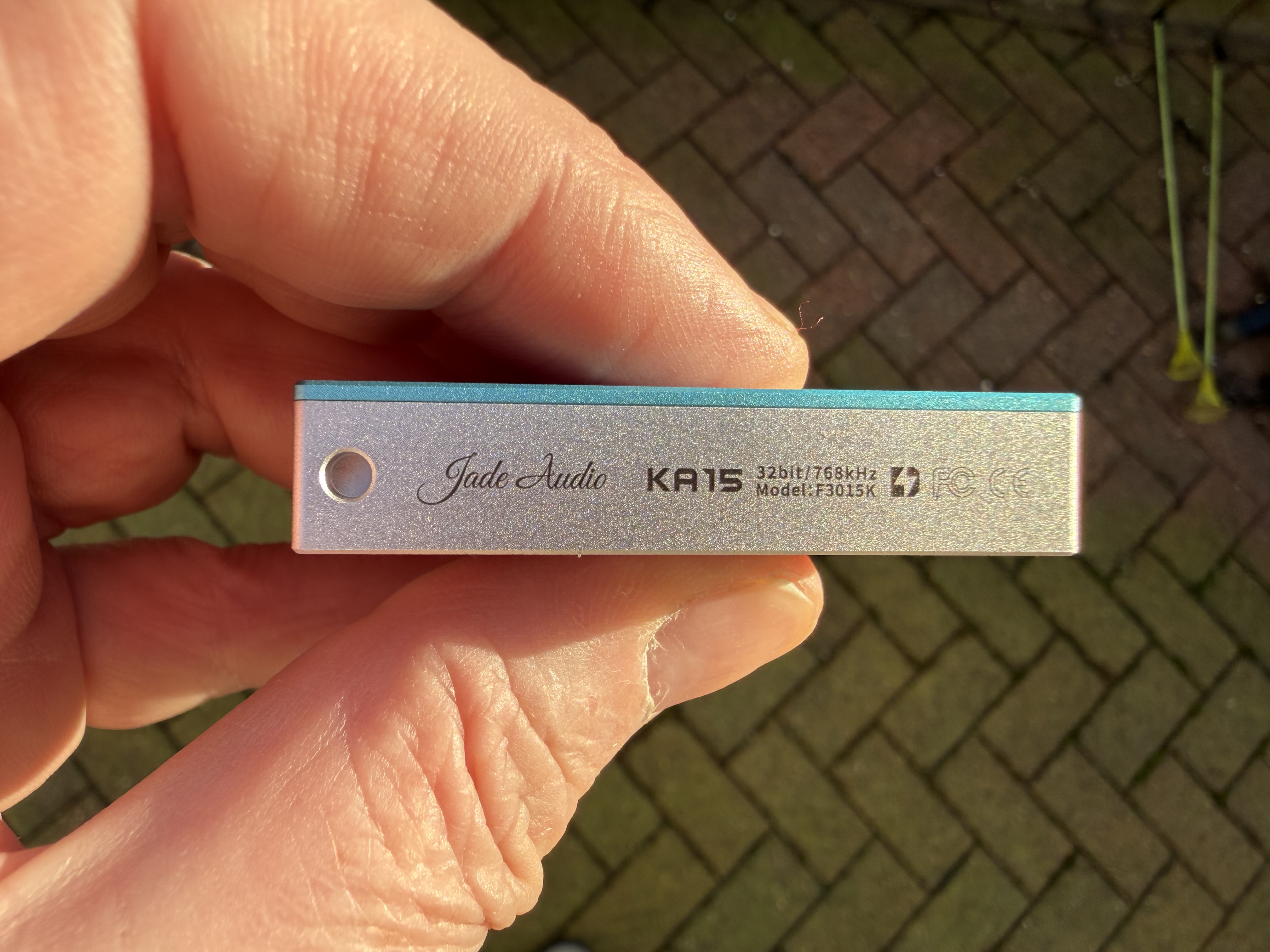 FiiO KA15 portable DAC side view showing product name and logo