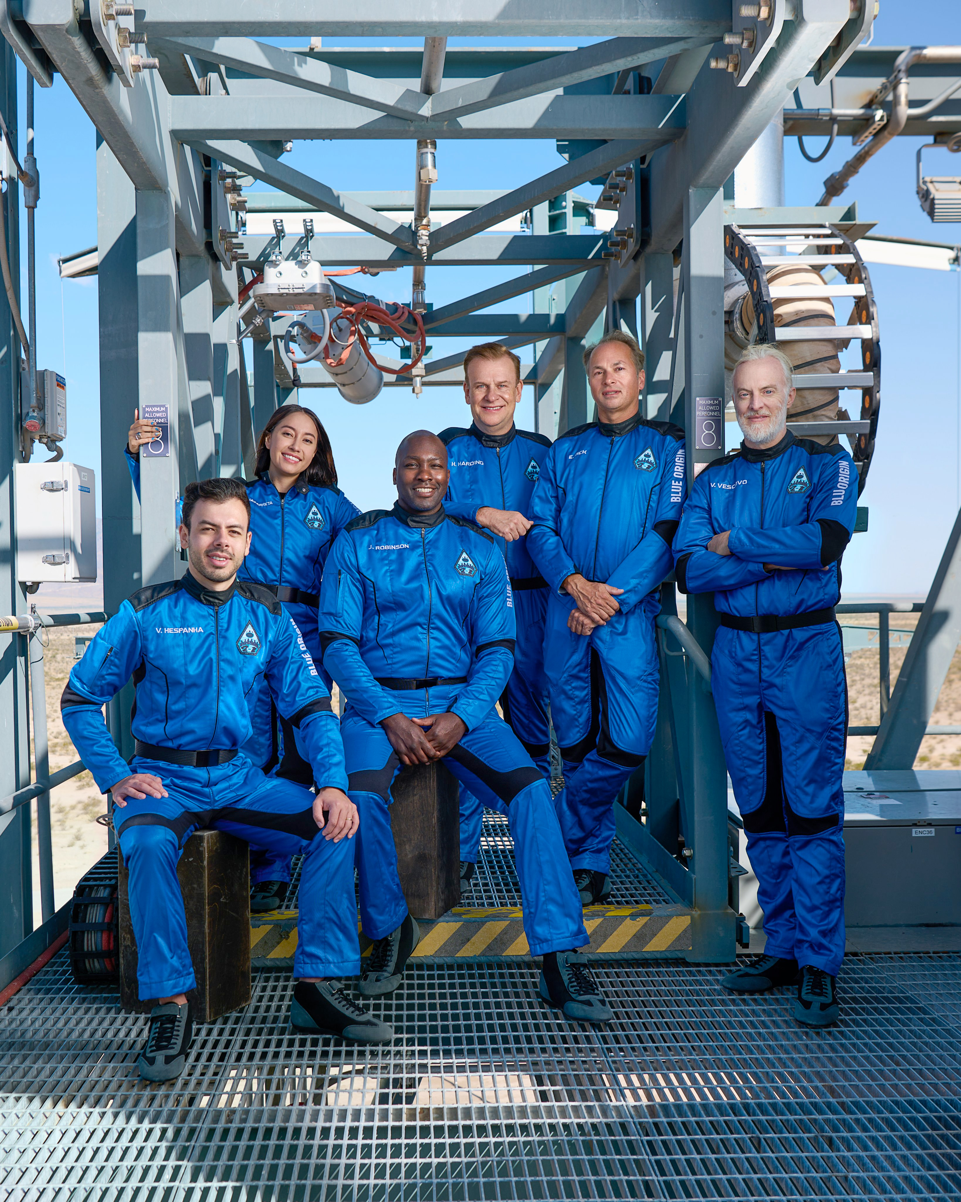 Blue Origin's New Shepard NS-21 crew pose for a photo on the gantry at the company's West Texas Launch Site One. From left to right: Victor Correa Hespanha, Katya Echazarreta, Jaison Robinson, Hamish Harding, Evan Dick and Victor Vescovo.