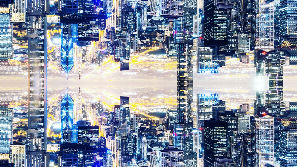 Image manipulation of the Chicago skyline with mirror effect, creating a new dimension with the city connecting upside down by the skyscrapers.