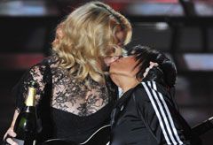 Marie Claire celebrity news: Madonna kisses a backing dancer on stage