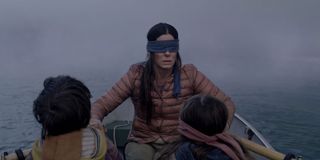 Sandra Bullock blindfolded on a boat with Boy and Girl in Birdbox