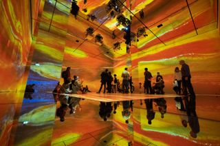 EM Acoustics powers the sound as guests look at a multi-colored display projected in an immersive experience in the UK.
