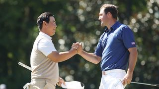 Tom Kim and Scottie Scheffler shake hands during the foursomes on Saturday morning at the 2022 Presidents Cup