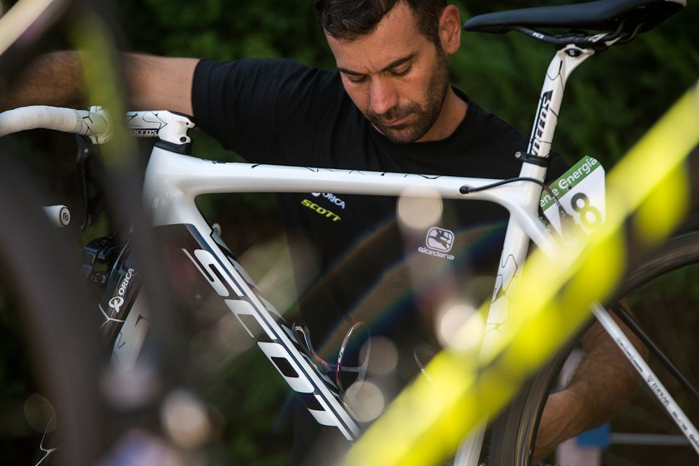 An Orica mechanic works on one of the bikes