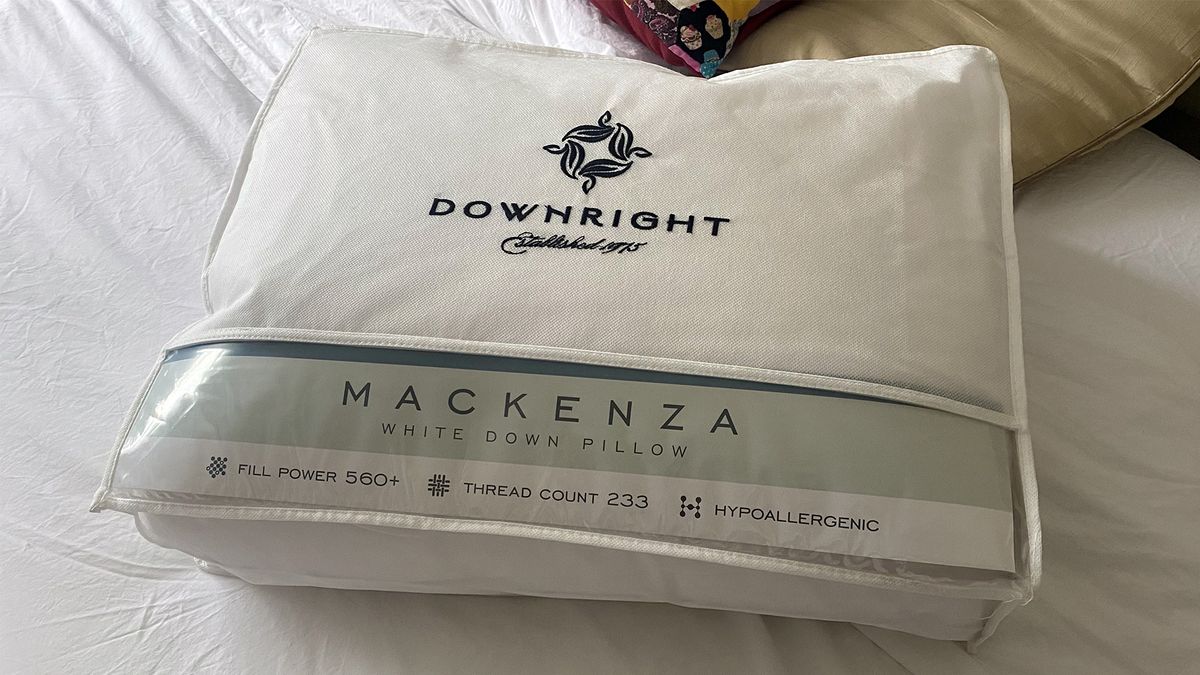 The Downright Mackenza WD pillow in its delivery bag on a bed in our reviewer's home