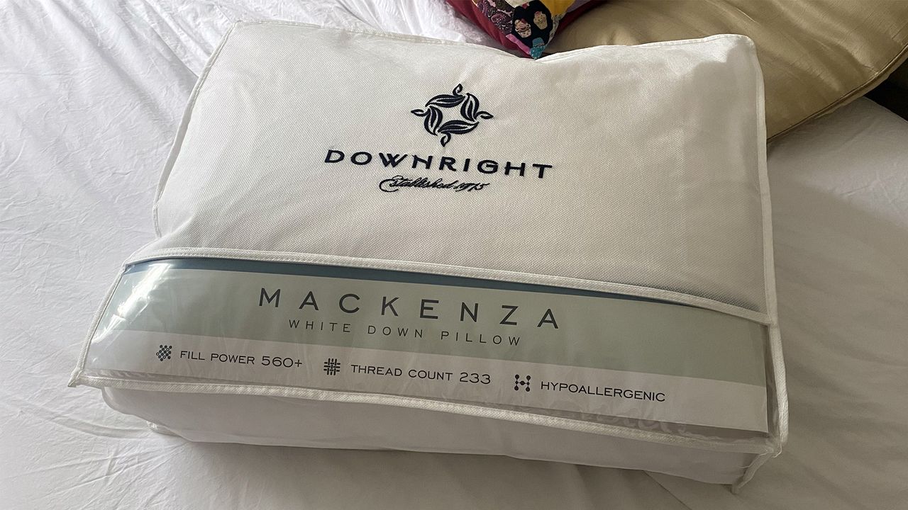 The Downright Mackenza WD pillow in its delivery bag on a bed in our reviewer's home