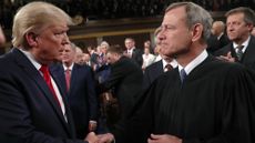 President Donald Trump and Chief Justice John Roberts speak during the State of the Union in 2020.