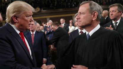 President Donald Trump and Chief Justice John Roberts speak during the State of the Union in 2020.