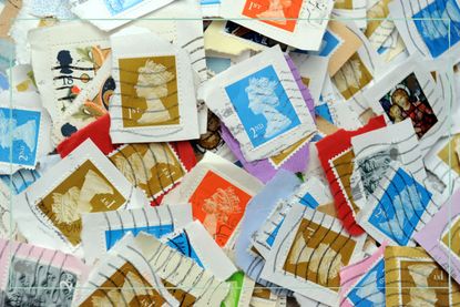 A pile of old stamps cut out from envelopes