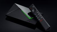 An Nvidia Shield TV Pro streaming device on a mirrored black background