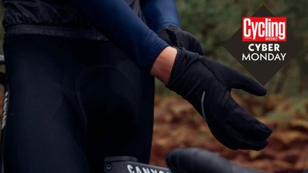 Cyclists pulling on a pair of black gloves