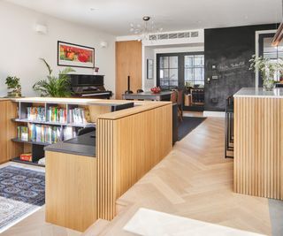 a study nook for children in an open plan kitchen and dining room