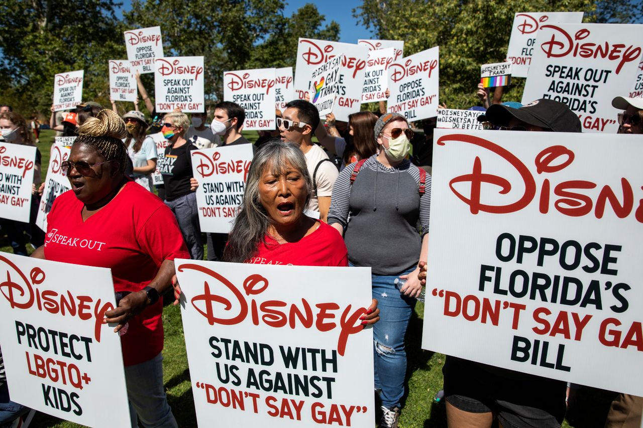 Protesters gather and hold signs urging Disney to protest Florida&amp;#039;s &amp;#039;Don&amp;#039;t Say Gay&amp;#039; bill