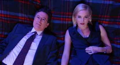 Stephen Colbert and Jennifer Lawrence share a blanket under the stars