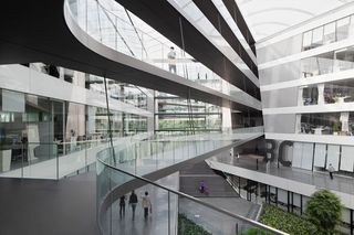 walk way bridges across the atrium connecting different areas in the adidas HQ