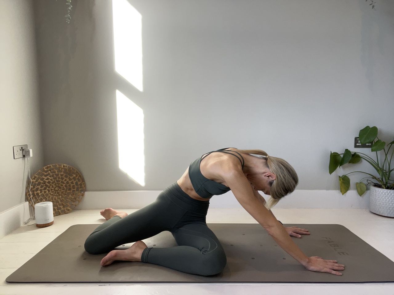 Pilates instructor Gemma Folkard demonstrating the mermaid stretch