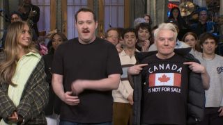 Mike Myers wears a t-shirt that says "Canada Is Not For Sale" on SNL.