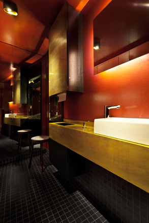 Bathroom with sink and stool for seating