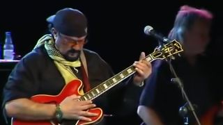 Steven Seagal performing and playing guitar
