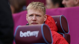Aaron Ramsdale of Arsenal looks on from the bench during the Premier League match against West Ham United at the London Stadium in Stratford, on February 11, 2024. (Photo by MI News/NurPhoto via Getty Images)