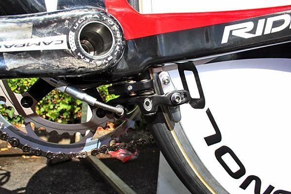 The rear brake sits where its shape will do the least damage to the airflow: under the bottom bracket.
