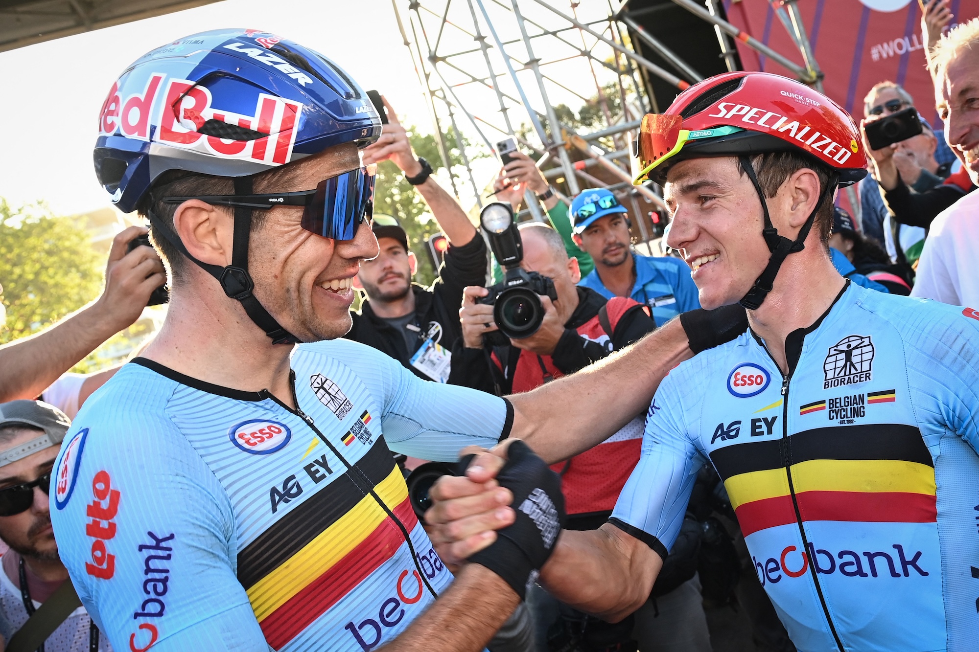 Belgian Wout van Aert and Belgian Remco Evenepoel celebrates after winning the men's elite road race at the UCI Road World Championships Cycling 2022, in Wollongong, Australia, Sunday 25 September 2022. The Worlds are taking place from 18 to 25 September. BELGA PHOTO DIRK WAEM (Photo by DIRK WAEM / BELGA MAG / Belga via AFP) (Photo by DIRK WAEM/BELGA MAG/AFP via Getty Images)