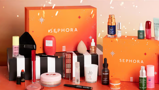 Orange Sephora beauty boxes next to beauty products