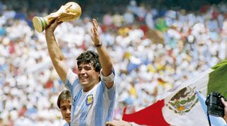 MEXICO CITY, MEXICO - JUNE 29: Diego Maradona of Argentina holds the World Cup trophy after defeating West Germany 3-2 during the 1986 FIFA World Cup Final match at the Azteca Stadium on June 29, 1986 in Mexico City, Mexico. (Photo by Archivo El Grafico/Getty Images)