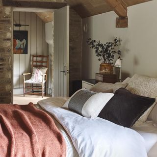 cosy looking bedroom in cottage with neutral colours