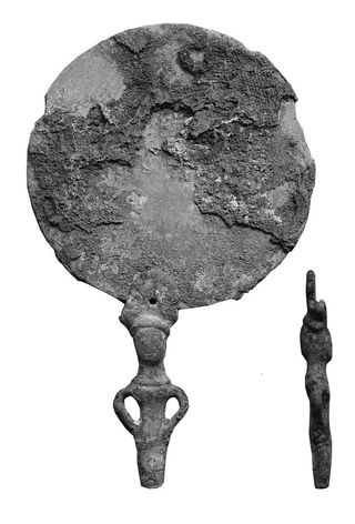 bronze mirror found with ancient warrior burial