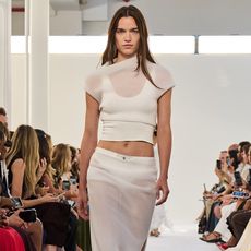 Brandon Maxwell Model wearing sheer top and sheer skirt on the runway