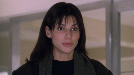 Sandra Bullock looks surprised in While You Were Sleeping.