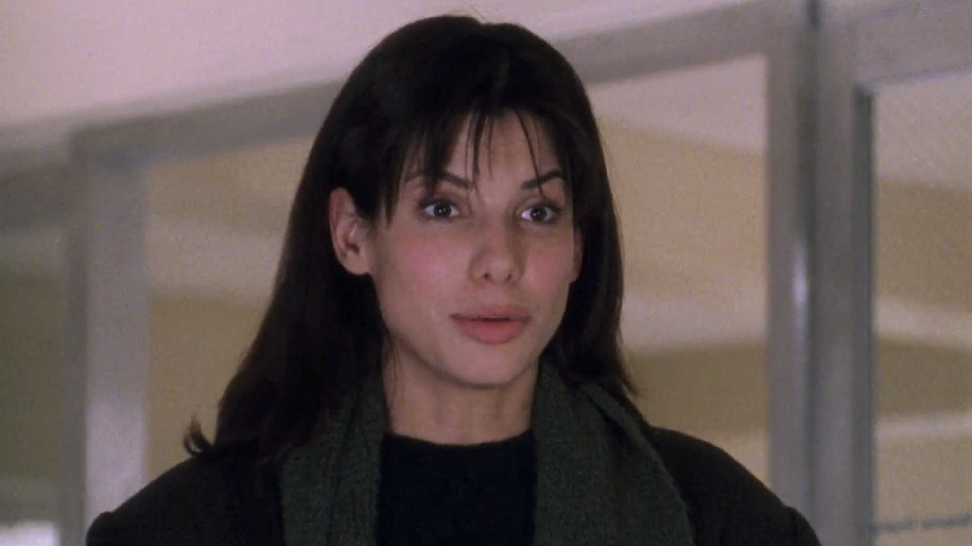 Sandra Bullock looks surprised in While You Were Sleeping.