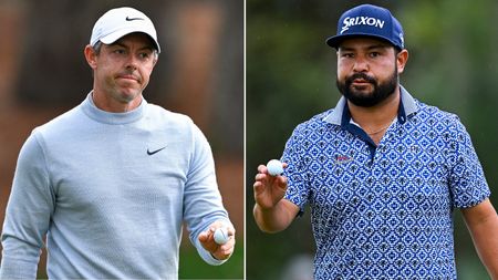 Rory McIlroy and JJ Spaun wave to the crowd