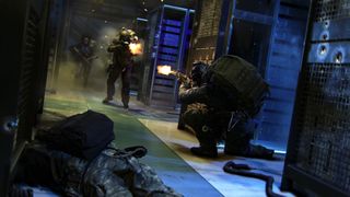 A promotional Modern Warfare 4 screenshot showing soldiers in combat in a dark server room.